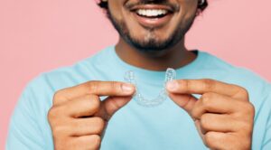 Man holding a mouth guard